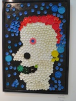 A portrait with bottle tops