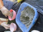 Filling in some papercrete into the bigger bowl