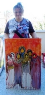 Nada and a painting she did in the workshop in March